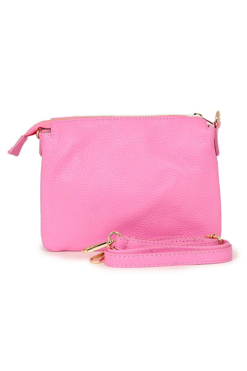 hot pink pebbled leather crossbody bag with zip closure and a detachable adjustable strap