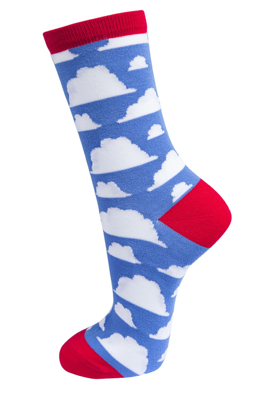 sky blue socks with red heel, toe and trim with an all over pattern of white fluffy clouds