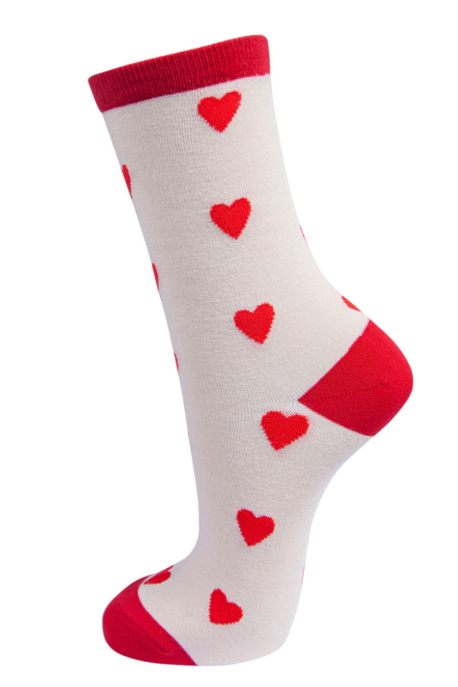 cream and red bamboo socks with an all over pattern of red love hearts