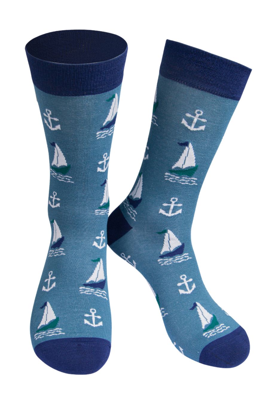 blue socks with a navy blue heel, toe and cuff with a pattern of sailing boats and anchors