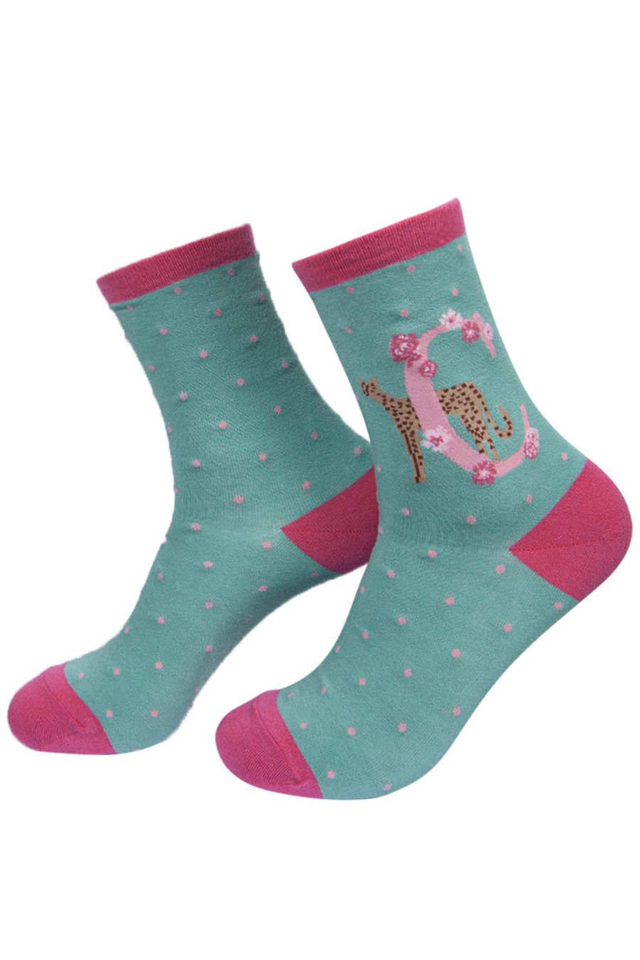 mint green socks with a large letter c, a cheetah and a floral pattern on the ankle